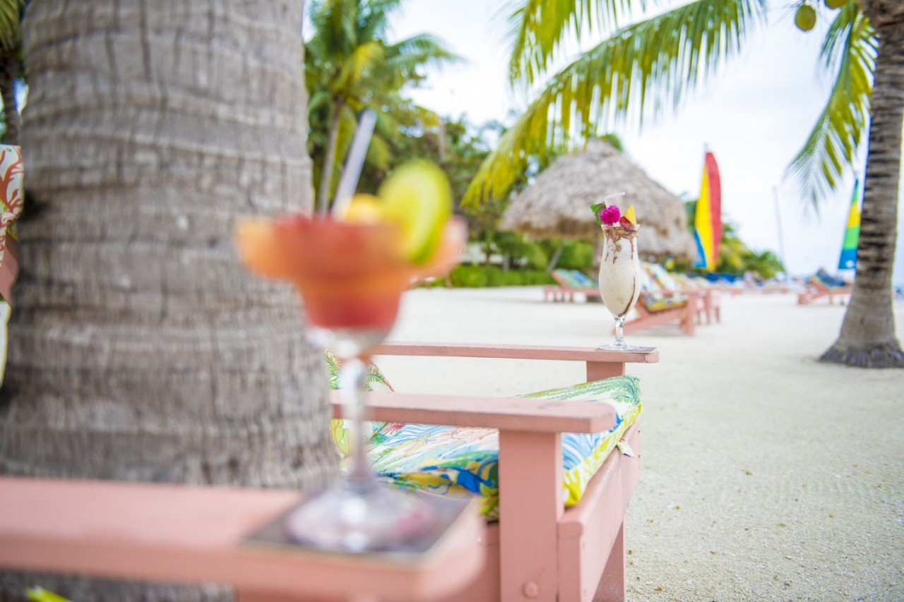 Relax with a tropical drink at St. George's Caye Resort